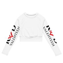 Load image into Gallery viewer, Flat lay photo of white long sleeve women's cropped top features crew neck and large bold red and black sleeve logo by Red Valenteen activewear