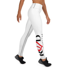 Load image into Gallery viewer, Right side view of model wearing sleek and flattering white leggings with high waist and featuring contrast stitch and large Red Valenteen logo design in black and red on one leg below the knew to the ankle.