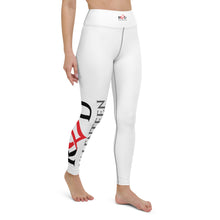 Load image into Gallery viewer, Image of barefoot model from the waist down, showcasing the brillant white premium quality breathable yoga or pilates leggings which have a dramatic bold splash of red and black color on the lower right leg from the knee down, being the Red Valenteen logo.