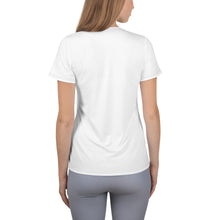 Load image into Gallery viewer, image of a model from the back view showing the fit of the white athletic dry fit tshirt with short sleeves, plain back, contrast dark stitch along hem lines.