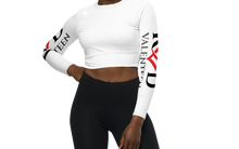 Load image into Gallery viewer, This image is a close-up of the front of the crisp bright white tight fitting cropped women's activewear  top, teamed with black tight shorts which adds pop and contrast to the black and red logos on both sleeves.