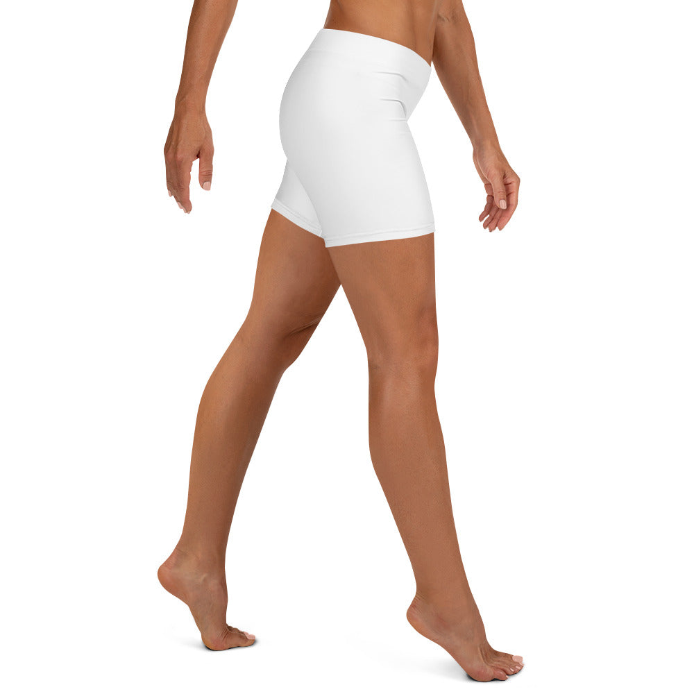 White athletic shorts worn by a person on a white background