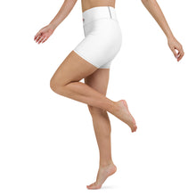 Load image into Gallery viewer, Image of a woman model from waist down wearing white lycra style sports shorts mid thigh length, with her knee bent. showing glimpse of the Red Valenteen logo on the front waistband, and the contrast stitich is visible on the side.