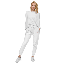 Load image into Gallery viewer, image of a slim female modelling a pair of luxury brand cotton Red Valenteen white slim fit track sweat pant, with small embroided logo position on left hip side, teamed with white sneakers and loose long sleeve white top