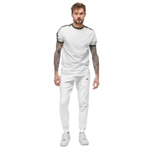 Load image into Gallery viewer, image of front facing slim male model wearing slim comfort fit white luxury 100% cotton track pants, which has small embroided logo of Red Valenteen on left side hip level, teamed with white tshirt and white runners