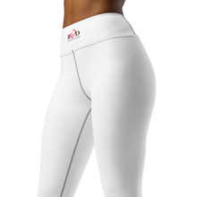 Load image into Gallery viewer, A close up image from the waist to the knees of a woman's white legging showcasing the sleek design and flattering style which includes the small Red Valenteen Logo on the high waist band.