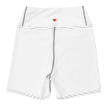 Load image into Gallery viewer, Lay flat image of back view of Red Valenteen body contouring tight fit shorts for yoga, bike, running, pilates, with contrast stitch on seams and red heart with wings centred on the back waistband.
