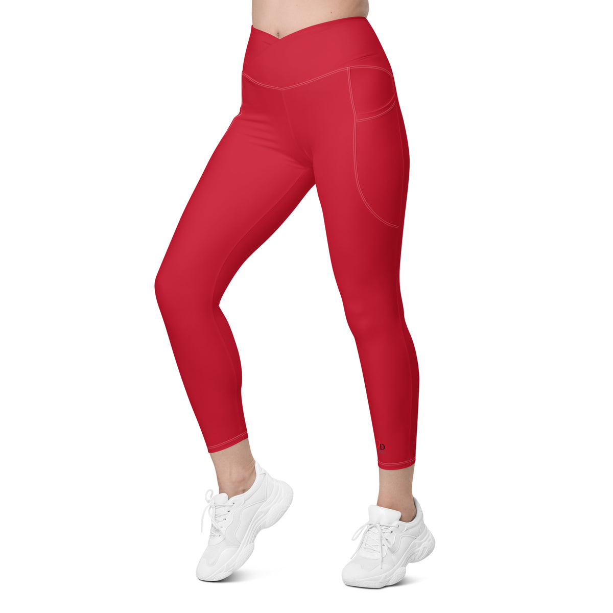 Red leggings with side pockets worn by a person on a white background