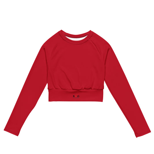 Red cropped activewear top with long sleeves and crew neck with 'Red Valentee' small logo on waist band section, on a white background