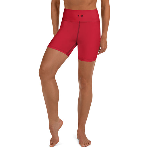 A model wearing bright red high-waisted athletic shorts with dark stitch contrast, and small Red Valenteen logo on waist band, against a plain white background.