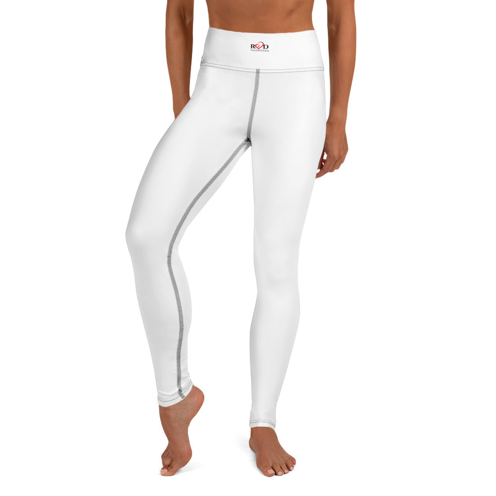 White leggings with contrast seam stitch and with a small logo on the waistband on a white background