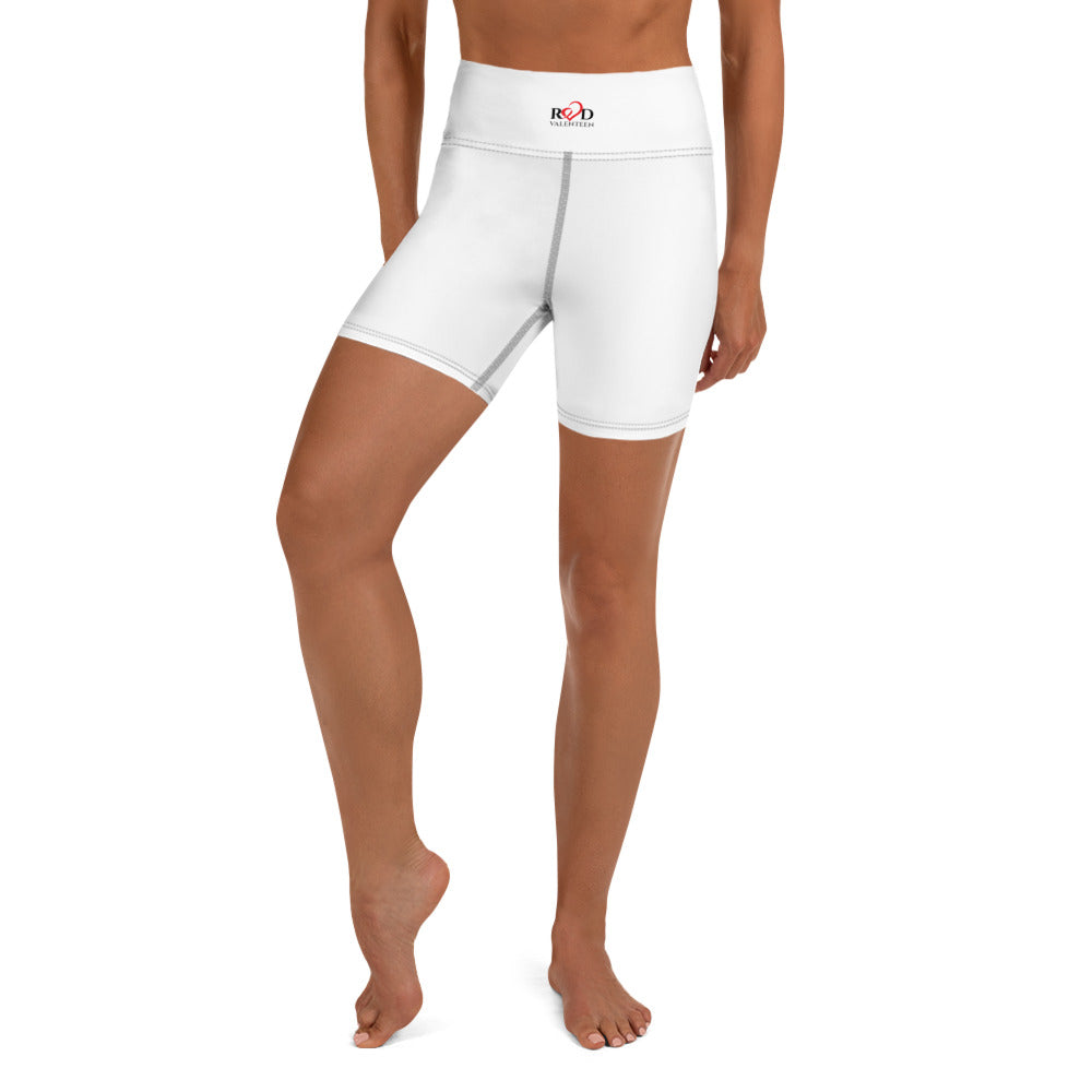 Front view image from the waist down of a tan model sporting a pair of premium quality mid thigh length body contouring shorts for any activity from yoga, bike riding, running or casual outings. High waisted with fashionable contrast dark stitch and small Red Valenteen logo design centred on the waistband.